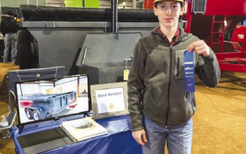 Bumpus displays the first-place ribbon he earned with his dump trailer at the San Angelo Ag Mechanics Show. COURTESY PHOTO