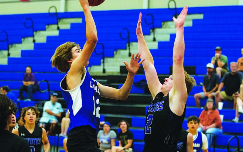 HUNTER KING | DISPATCH RECORD Jax Pratus tosses a floater toward the basket during last year’s summer league here in Lampasas.