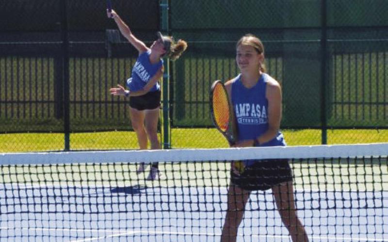 The White doubles team serves during one of their matches. COURTESY PHOTO | KENNETH PEISER