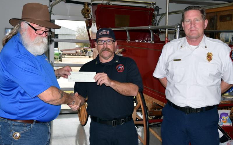 Accepting a $500 donation from Sartoga Masonic Lodge #546 representative Senior Warden Guy R. Niles for the Lampasas Fire Department’s annual toy drive are Deputy Chief of Operations Cory Greiner, center, and Deputy Chief of Administration Joe Adams. dorton q. matthews | courtesy photo