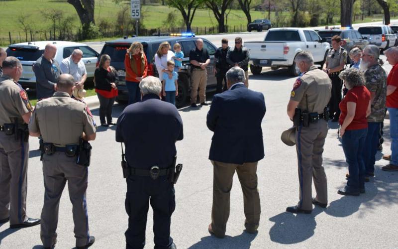 More than 30 law enforcement officers, along with their friends and family members, gathered Thursday outside Afredo’s Mexican Restaurant to pay respects to fallen Texas Department of Public Safety Trooper Chad Walker. MONIQUE BRAND | DISPATCH RECORD