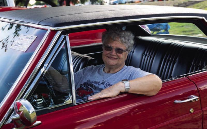 ADAM BARRIOS | DISPATCH RECORD Barb Weber sits back in the driver’s seat of a 1965 Buick Grand Sport at Sulphur Creek Car Cruise held on June 28.