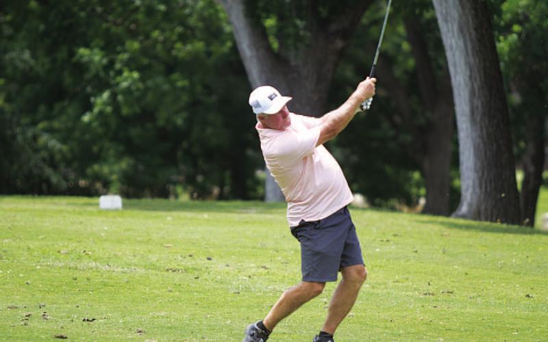 HUNTER KING | DISPATCH RECORD Scott Haverly follows through on an approach shot.