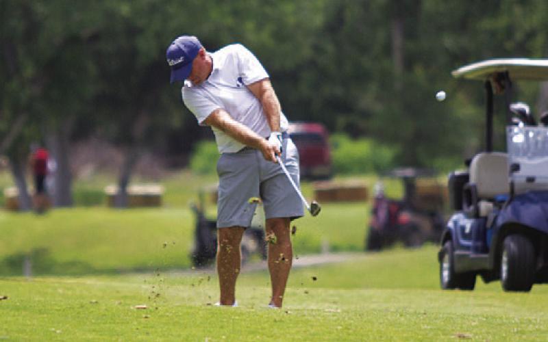 HUNTER KING | DISPATCH RECORD Schulze hits a second shot on the fifth hole at Hancock Park Golf Course.