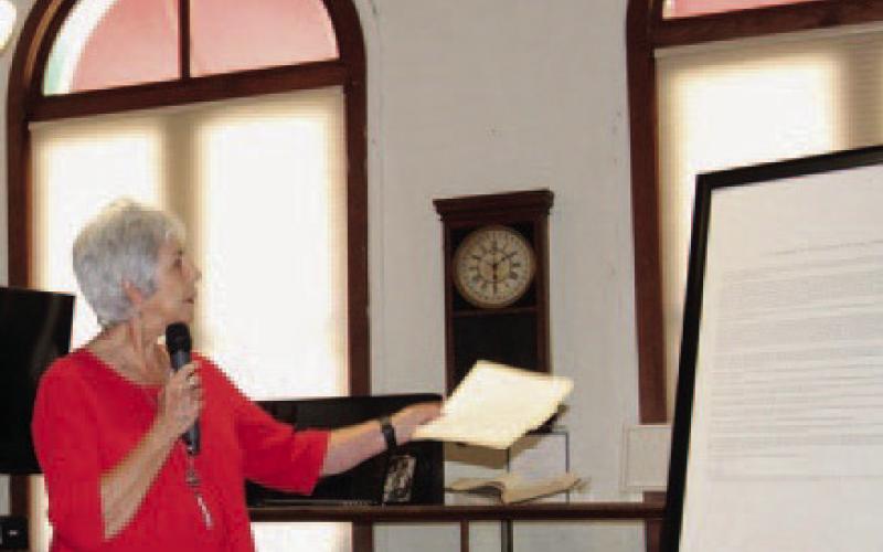Mayor TJ Monroe, standing at the Lampasas County Museum, reads the proclamation opening a year of celebration for the Lampasas sesquicentennial. JOYCESARAH MCCABE | DISPATCH RECORD