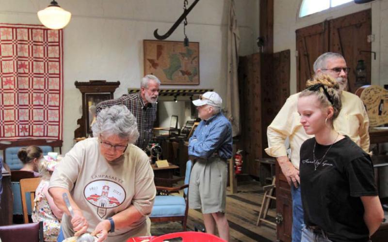 Museum board member Sherry Boultinghouse, at left, serves up ice cream for those in attendance at Friday’s ceremony to recognize the 150th anniversary of the city’s incorporation. The Texas Legislature recognized the creation of Lampasas on April 21, 1873. JOYCESARAH MCCABE | DISPATCH RECORD