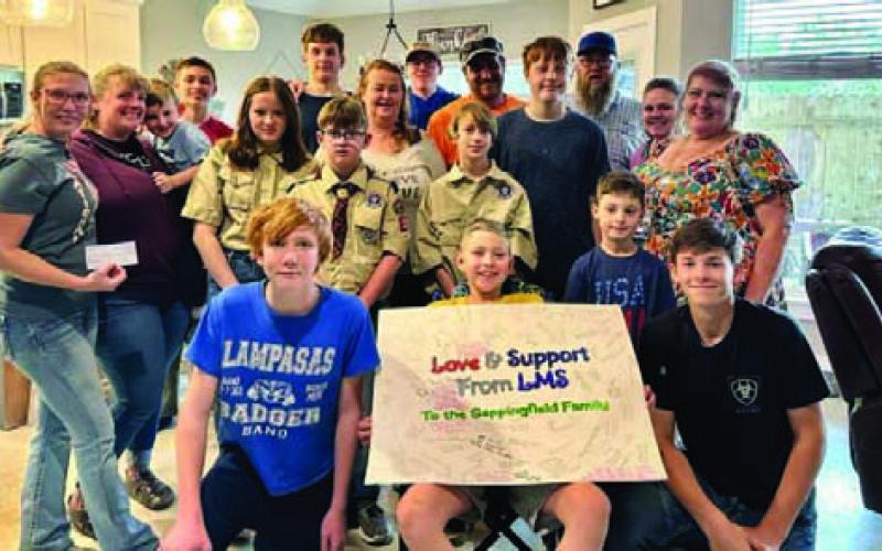 Front and center, Luke Sappenfield is surrounded by family members and Scouts from Troop 200, Troop 400 and Pack 100 who have helped raise funds for the Sappenfields’ medical expenses. COURTESY PHOTO