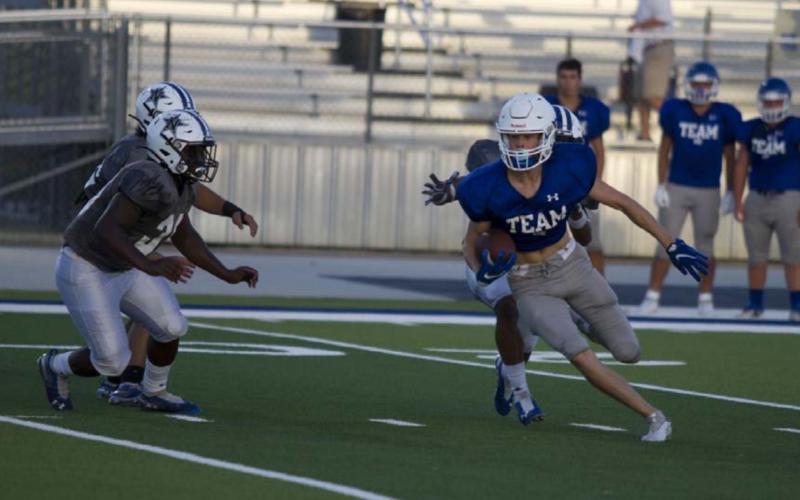 Nate Borchardt darts through the Navasota defense after a catch over the middle. Borchardt finished with two touchdowns during the second tune-up for the Badgers. HUNTER KING | DISPATCH RECORD