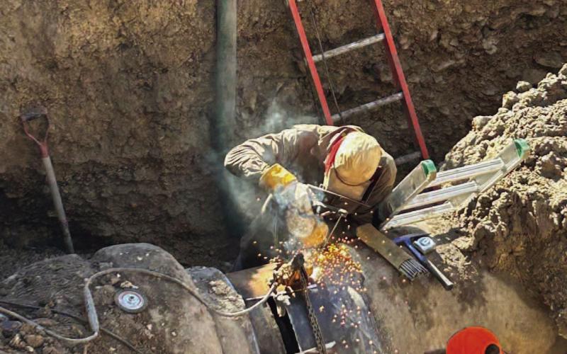 Welders work to repair the transmission line where a leak occurred Tuesday, affecting water service to numerous customers in the Kempner and Lampasas areas. COURTESY PHOTO | CITY OF LAMPASAS