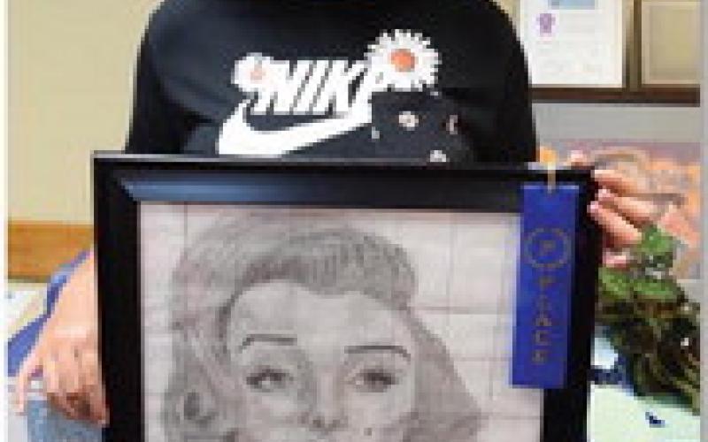 Amira McDonald won junior champion in art with a Marilyn Monroe pencil drawing. ALEXANDRIA RANDOLPH | DISPATCH RECORD