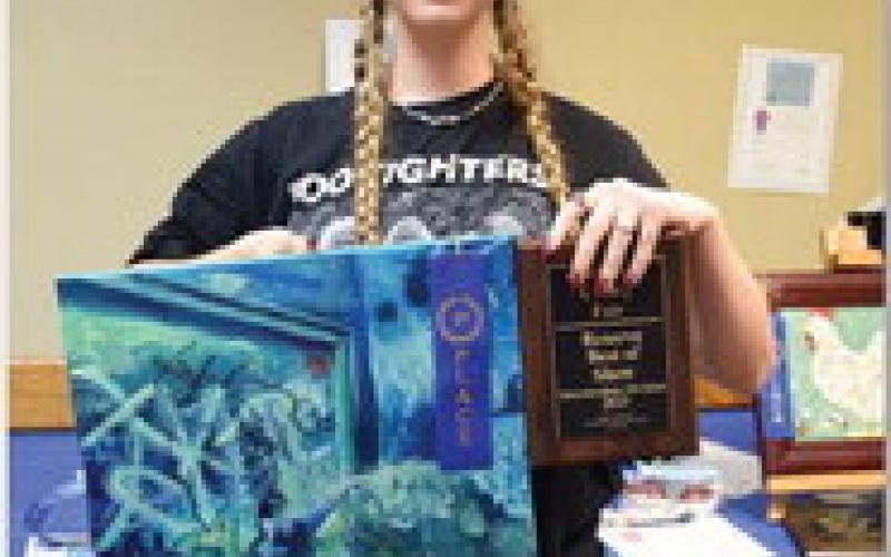 Daphne Davenport won intermediate champion in art with her piece titled “Acrylic woman in mirror.” ALEXANDRIA RANDOLPH | DISPATCH RECORD