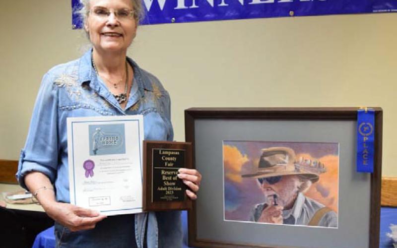 Marilyn May won adult champion in art with her cowboy colored pencil piece. ALEXANDRIA RANDOLPH | DISPATCH RECORD