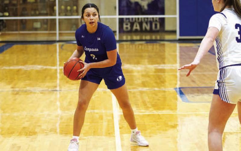 Johnnie Lewis looks for a cutting teammate. HUNTER KING | DISPATCH RECORD