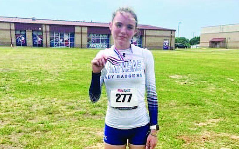 COURTESY PHOTO | LAMPASAS ATHLETICS FACEBOOK Teagan Reiss poses with her second-place medal from the regional track meet last week.
