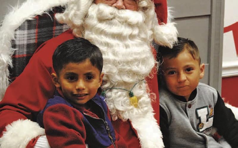 Children of all ages are invited to visit with Santa from 3:30-6 p.m. Dec. 2 at the downtown Ajinomoto Foods lobby during the Carol of Lights festivities to usher in the Christmas season. FILE PHOTO