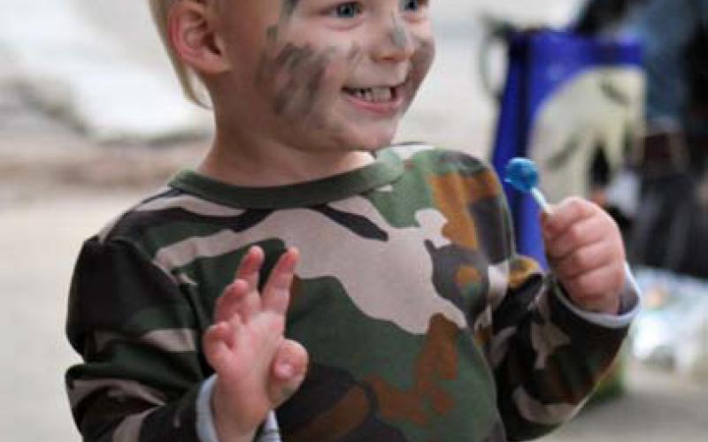 Briggs Perryman, age 2, greets other trick-ortreaters at Squared Silly. joycesarah mccabe | dispatch record
