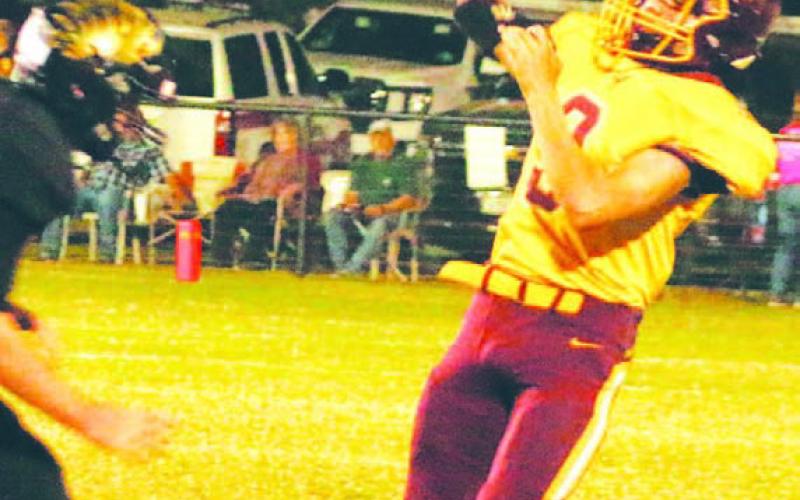 Jordan Livesay attempts a pass while avoiding the rush against Jonesboro. MASON HINES | DISPATCH RECORD