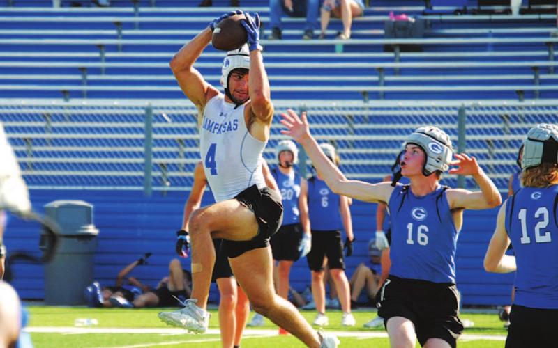 Aden Rascoe jumps to make a catch over the middle against Georgetown High on Monday. HUNTER KING | DISPATCH RECORD