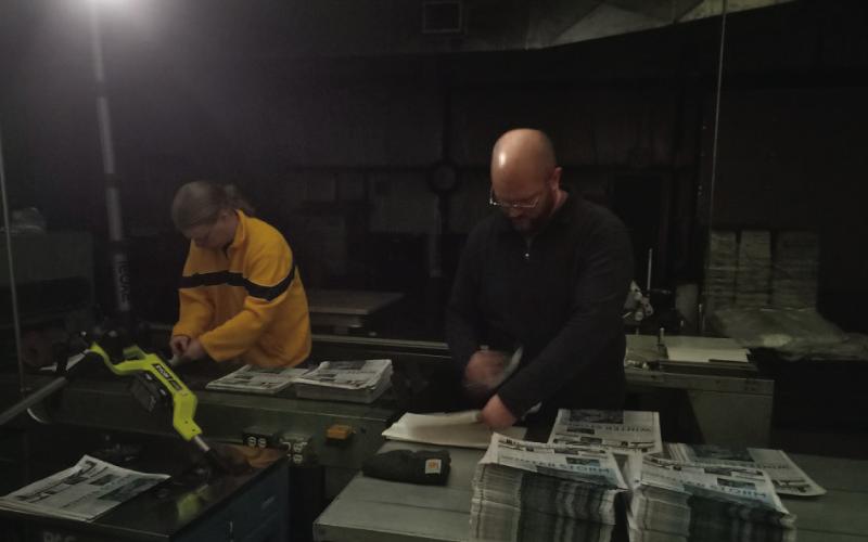 Mail clerk Jordan Brogan, left, and Daniel Philhower – owner of 10 newspapers, including the Taylor Press – help prepare newspapers for eventual distribution. Not pictured: press foreman Phillip Gutierrez. JIM LOWE | DISPATCH RECORD