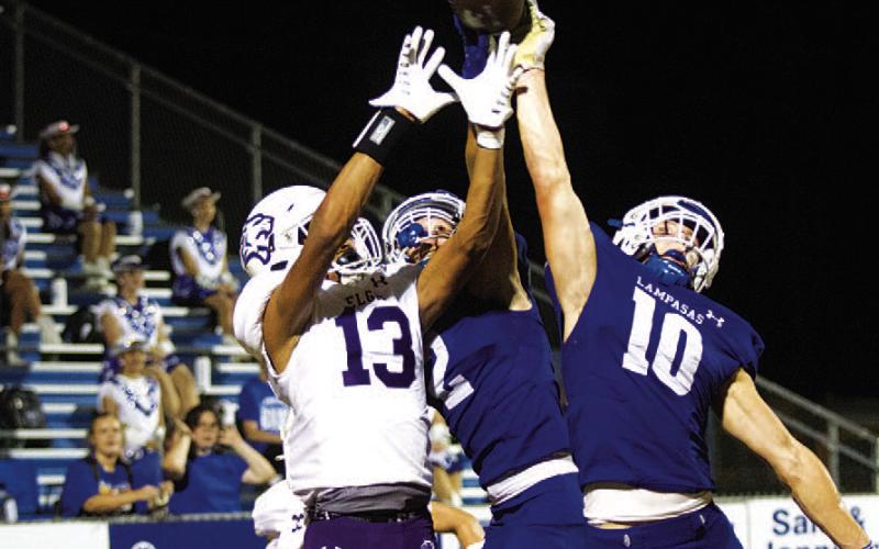 HUNTER KING | DISPATCH RECORD Brock Langford (10) and Ayden Shaw (2) knock away the final pass of the game.