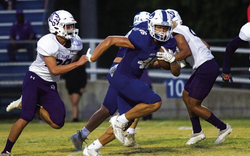 HUNTER KING | DISPATCH RECORD Haegan Oncken breaks up the middle of the field after a screen pass.