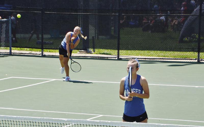 Sydney Unger (back) and Taylor Sheard compete at the regional tennis tournament last week. COURTESY PHOTO | KENNETH PEISER
