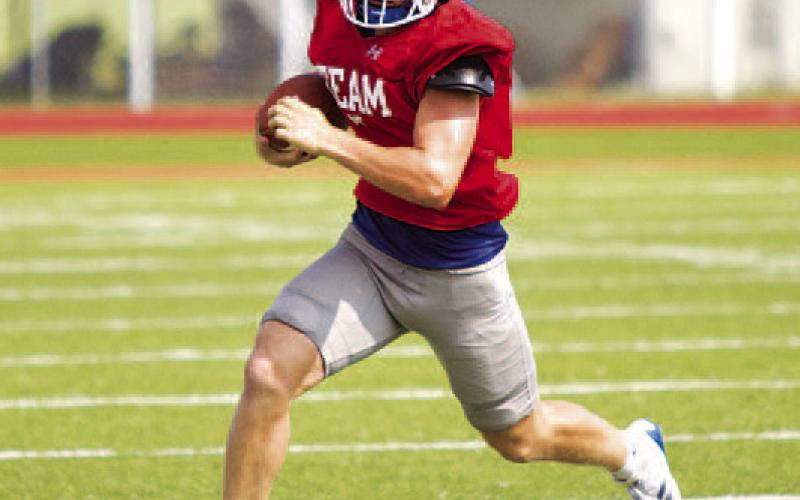 Reed Jerome runs to the outside. His ability to use his legs should be an important weapon for the Badgers in 2024. HUNTER KING | DISPATCH RECORD