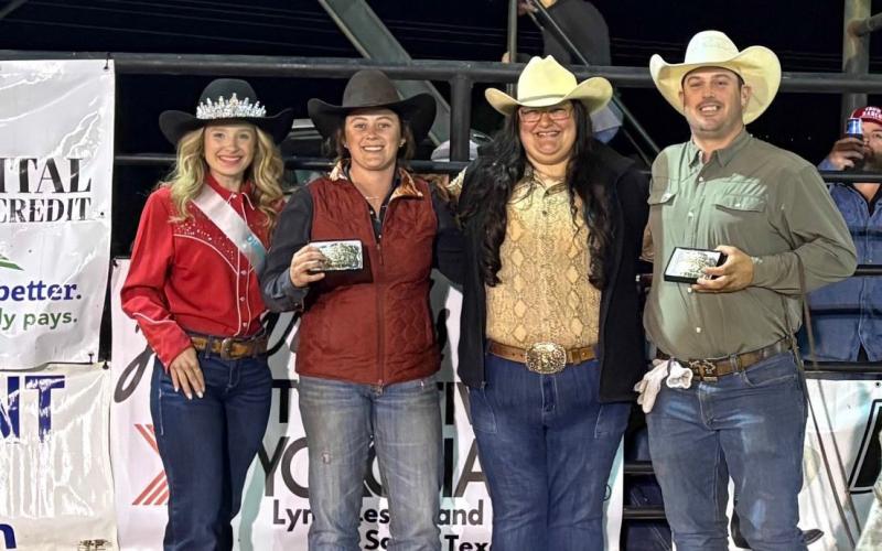 Rodeo Queen Karlee Parker, at left, helps congratulate the team roping winners as they show off their buckles. The event was sponsored by Capital Farm Credit of San Saba. COURTESY PHOTO | TERRI HARRIS