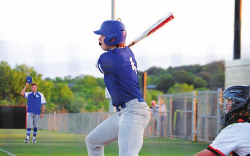 Rawlin Smith follows through on a swing after hitting a single into left field against Llano. HUNTER KING | DISPATCH RECORD