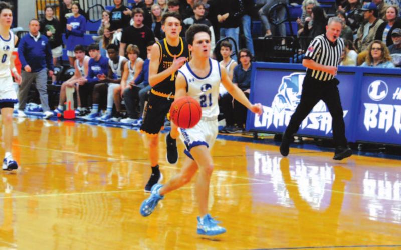 Austin Wilson dribbles to the rim on a breakaway for a layup. HUNTER KING | DISPATCH RECORD