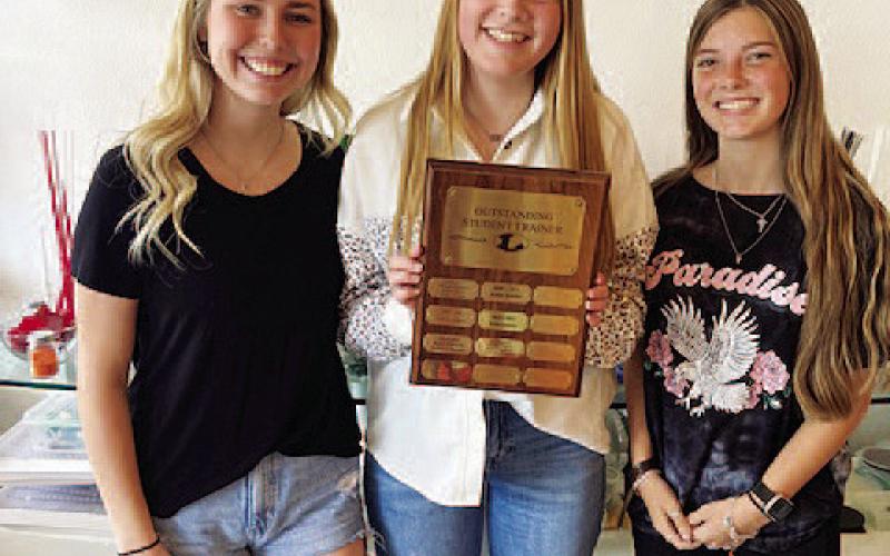 COURTESY PHOTO | JAN BRISTER Greenlee Chism, left, Emily Tower and Kewe Sanford earned trainer of the year honors.