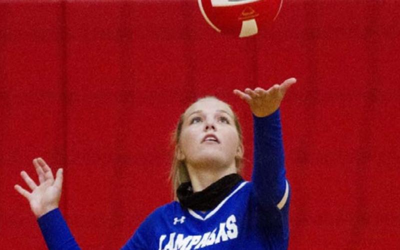 Laurcy Bender prepares to serve for the Lady Badgers during a game last year. FILE PHOTO