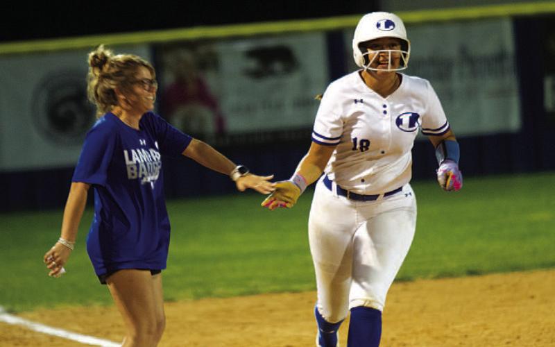 HUNTER KING | DISPATCH RECORD Madison Magilke high-fives head coach Blakeli Brookreson after one of her home runs against Marble Falls last Thursday.