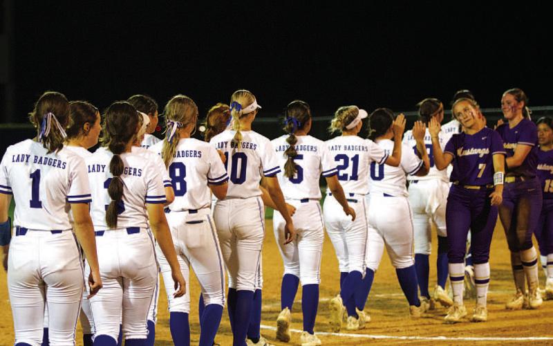 The Lady Badgers shake hands with the Lady Mustangs after the Lampasas win. HUNTER KING | DISPATCH RECORD