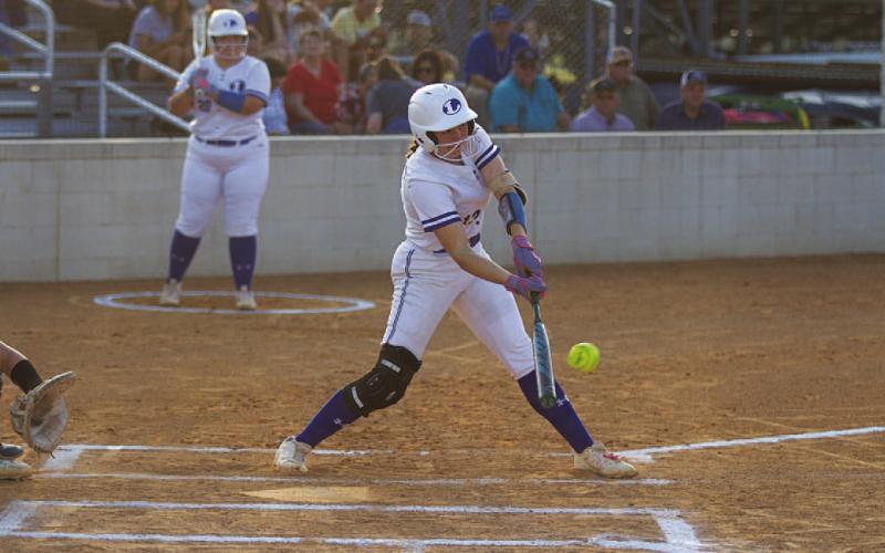 Brooklyn Farmer swings and drives a ball into the outfield for one of her hits against Marble Falls. HUNTER KING | DISPATCH RECORD