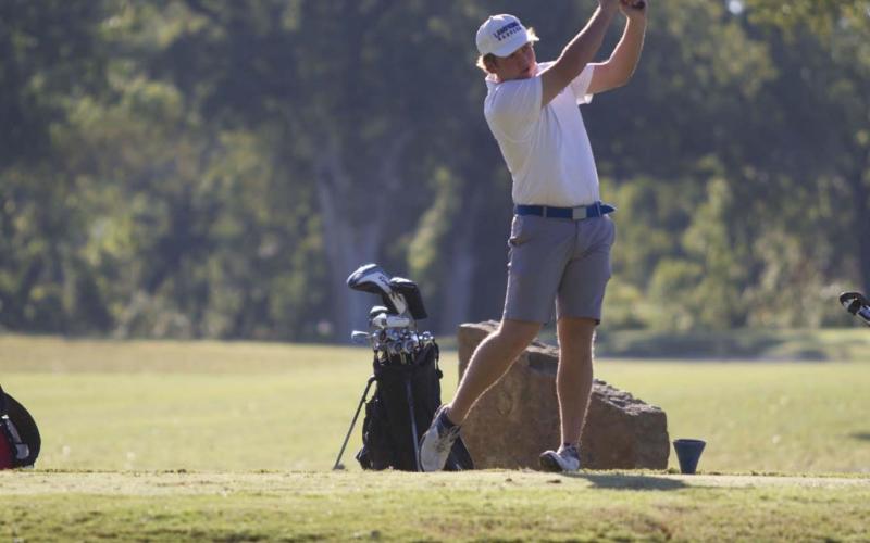 HUNTER KING | DISPATCH RECORD Jaxon Tomme follows through on a drive on the fourth tee box during the home tournament at Hancock Park Golf Course in Lampasas on Oct. 8.