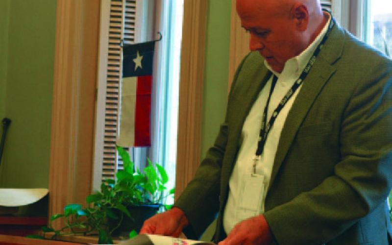 Hill Country Transit General Manager Raymond Suarez looks at his presentation notes while speaking to the Lampasas County Commissioners Court in the meeting Sept. 9. Suarez outlined the new structure for the regional transportation service. ERICK MITCHELL | DISPATCH RECORD