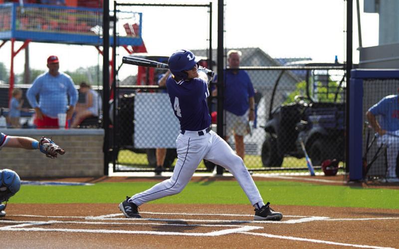 Timber Gholson hits a ball into the right-center gap during the playoff series. HUNTER KING | DISPATCH RECORD