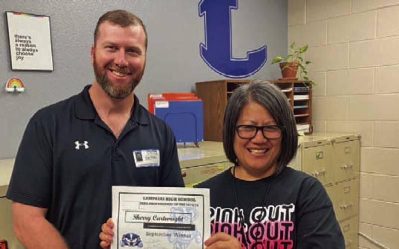 Sherry Cartwright was named Paraprofessional of the Month for September. Assistant Principal Ryan Race said Cartwright works behind the scenes as the registrar and helps keep the school rolling. Clay Phillips of Farm Bureau Insurance donated a coffee cup and gift card for the honorees. COURTESY PHOTO