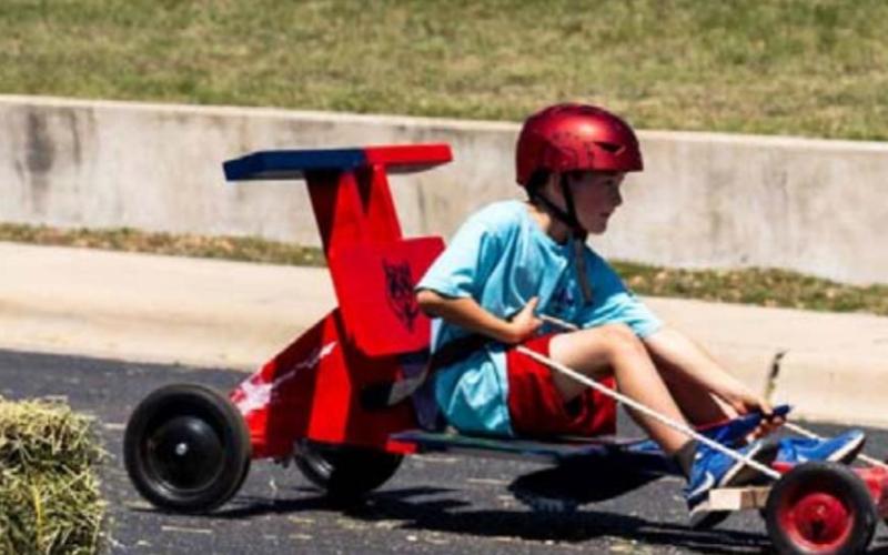 Phillip Ischy, Pack 100 Wolf Den, had a fun pass in the race. JEROMIAH LIZAMA | DISPATCH RECORD