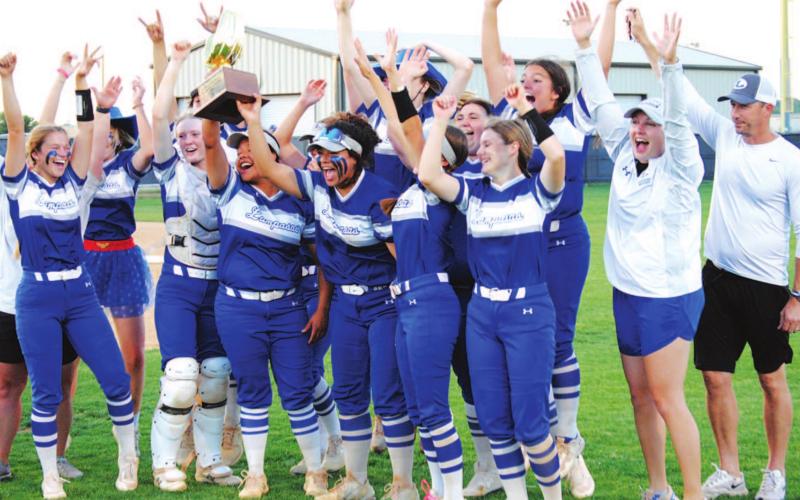 The Lady Badgers celebrate with their bi-district championship trophy after beating Graham last Friday night. HUNTER KING | DISPATCH RECORD