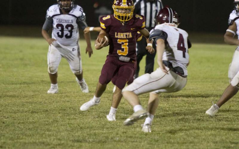 Alonso Caso tries to move past a Lingleville defender during the season-opener for the Hornets last Thursday. HUNTER KING | DISPATCH RECORD