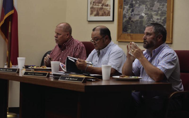 Trustees, from left to right, Randy Morris, Harvey Stinnett and Jeff Rutland enjoy meals prepared by Lampasas High School culinary arts students before Monday’s school board meeting. ERICK MITCHELL | DISPATCH RECORD