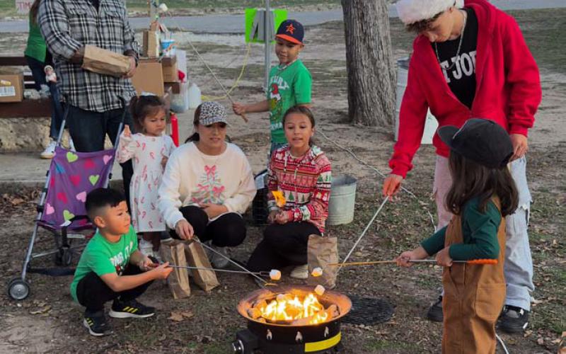Christmas on the Creek visitors were treated to s’mores by Girl Scout troops during Saturday’s festivities. ADAM BARRIOS | DISPATCH RECORD