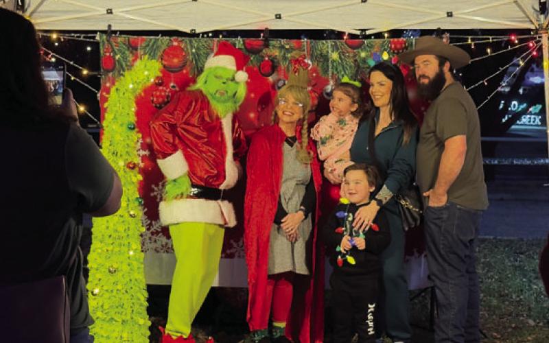 Families enjoyed with photos with the Grinch at Christmas on the Creek. ADAM BARRIOS | DISPATCH RECORD