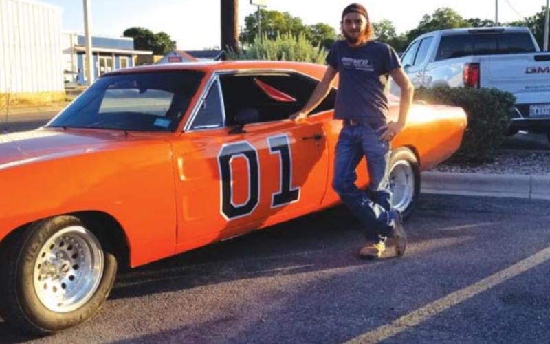 Showing off his Dodge Charger