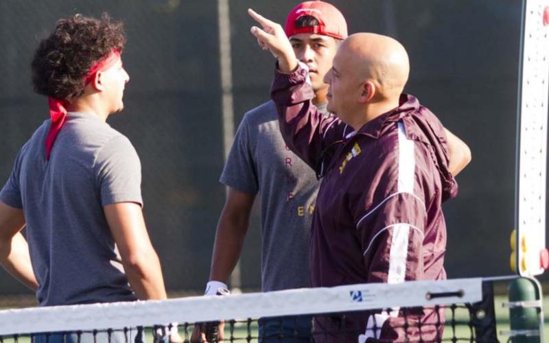 Coach Frank Reyes III gives instructions to Jaimes and Caso Prado during a break in action. JEFF LOWE | DISPATCH RECORD