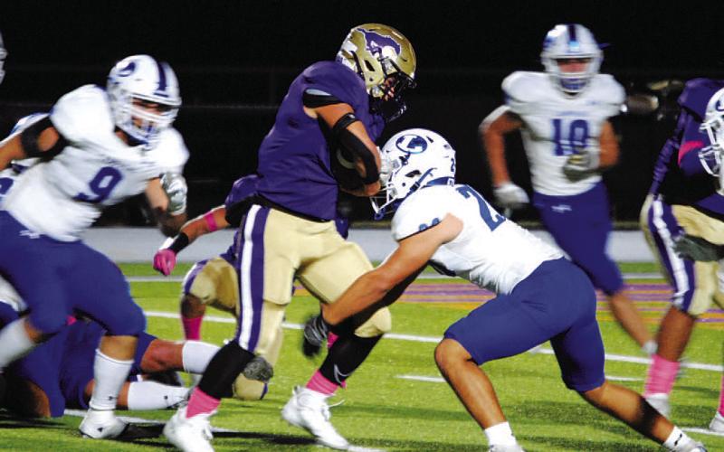 Levi Rivera makes the tackle on the Marble Falls runner. HUNTER KING | DISPATCH RECORD