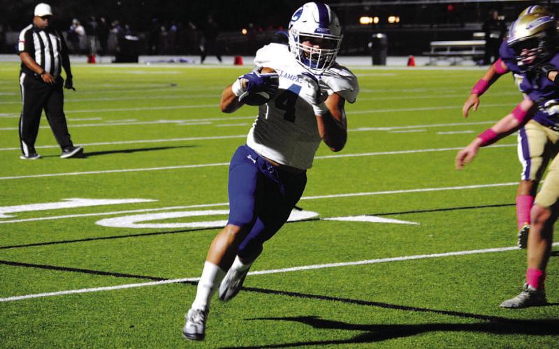 Aden Rascoe runs into the end zone for the first of his five touchdowns against Marble Falls. HUNTER KING | DISPATCH RECORD