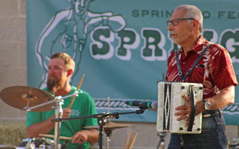 Matt McDonald, on drums, and Albert Perez, accordionist, jam during the Hayloft Party on Tuesday. mason hines | dispatch record